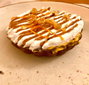 Pumpkin pie: chocolate pate sablee, pumpkin cream with chocolate drops, walnut and cinnamon pralines, orange zest  at Nativa in Rome