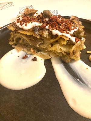 Lasagna with artichokes, mint besciamella, fried capers, lemon cream and dried tomatoes  at Nativa in Rome