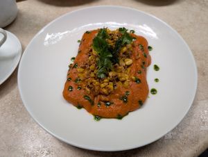 Tamal de Espinaca (Spinach tamal with red peanut sauce). Simply amazing. at La Cabra Iluminada in San Miguel De Allende