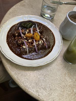 Plantain mole, spinach tamal, Verde enchiladas   at La Cabra Iluminada in San Miguel De Allende