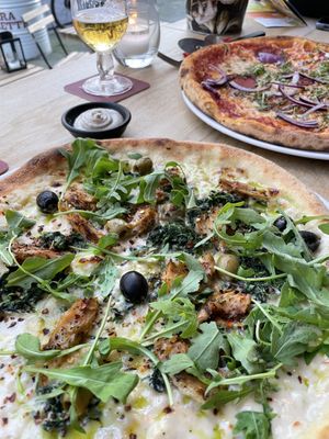 Pizza with Béchamel sauce and vegan chicken and salami pizza with red onion.   at Vegan Pizza Bar in Rotterdam