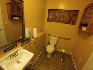 Restrooms (step to get into the bathroom) at Raw Can Roll Cafe in Wayne