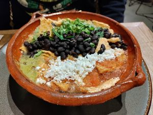 Wheat crackling in two salsas with beans at Ojo de Maíz in Mexico City