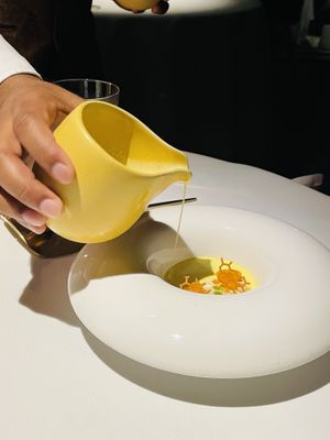 Adding in pistachio saffron milk  at Haoma in Bangkok