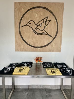 Sign & t-shirts at Early Bird Vegan in Tempe