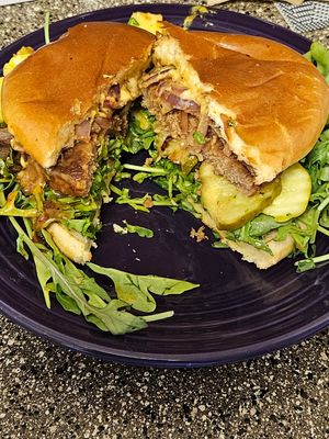 Vegan patty house made Cheez sauce,BBQ , grilled onions, arugula, on a brioche bun 😋 at Early Bird Vegan in Tempe