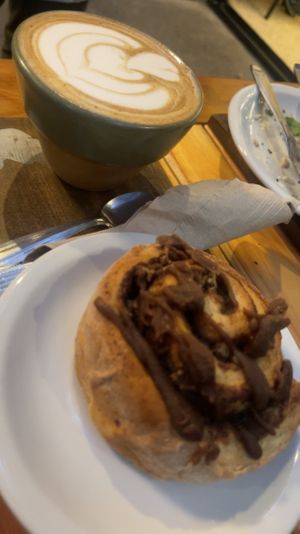 Cappuccino and Chocolate cinnamon roll.  at Oso Blanco in Mar Del Plata