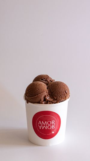A coconut base ice cream infused with chocolate, rich in flavor and high in cocoa yet very mild in taste mixed with chocolate chips. at Amor Amor in Doha