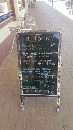 A-frame advertising vegan options at Keith Bakery and Coffee Shop in Keith