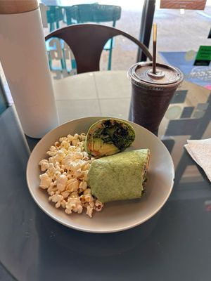 Veggie wrap with vegan popcorn and spring street smoothie  at The Juice Stop in Jupiter