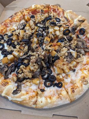 Custom vegan pizza with vegan chicken, mushrooms and black olives at Toppers Pizza in Indianapolis
