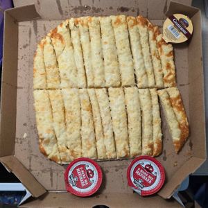 full order vegan stix. comes with 3 sauces of your choice. garlic sauce is vegan (confirmed with manufacturer) at Toppers Pizza in Indianapolis