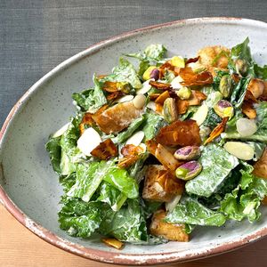 Smoked Coconut Bacon Kale Caesar Salad served with Caesar Dressing at Golden State Vegan Sushi in Bangkok