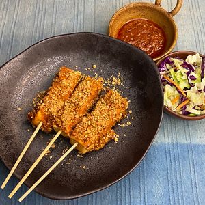 Peanut-Crusted Tofu Skewers served with Spicy Satay Peanut Dip & Vinaigrette Salad at Golden State Vegan Sushi in Bangkok