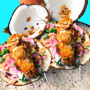 Coconut-Almond Fish Tacos - Coconut-Almond Crusted Fish Fillets, Ranch Coleslaw, Pickled Onions, Grilled Tortilla served with 3 Styles of Hot Sauce 2 pcs at Golden State Vegan Sushi in Bangkok