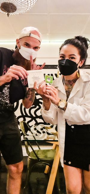 Giving the manager a Happy Cow excellent reviews sticker.  at Golden State Vegan Sushi in Bangkok