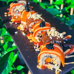 Crouching Tiger - Seared Eggplant Unagi, Carrot, Puffed Rice, Caviar, Sriracha Mayo, Hot Sauce at Golden State Vegan Sushi in Bangkok