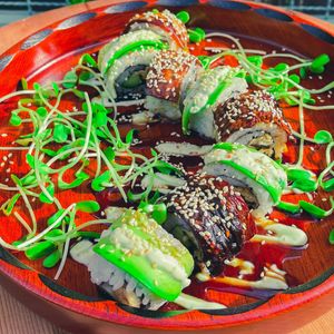 Caterpillar - Seared Eggplant Unagi, Cucumber, Eggplant Tempura, Avocado, Avocado Crema, Vegan Sweet Eel Sauce at Golden State Vegan Sushi in Bangkok