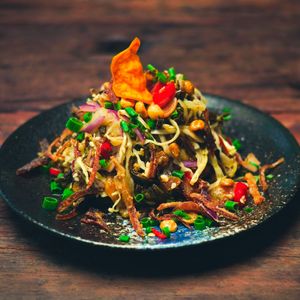 Tea Leaf Salad - Mixed Nuts, Herbs, Chili, Cabbage, Burmese Chips, Crispy Shallots  at Golden State Vegan Sushi in Bangkok