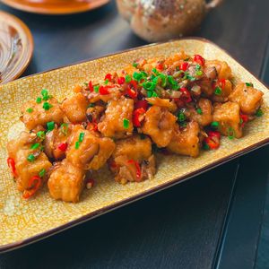 Spicy Szechuan Tofu- Fry Tofu, Mushroom, Szechuan Chili Sauce at Golden State Vegan Sushi in Bangkok