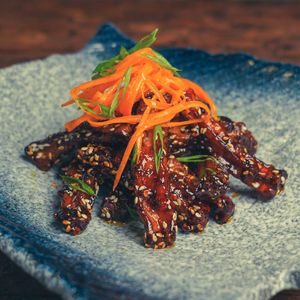 Sticky Mushroom - Fry Mushroom, Sweet Chili Sauce, Sesame, Pickled Carrots at Golden State Vegan Sushi in Bangkok