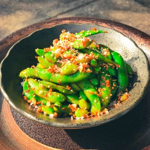 Spicy Edamame - Steamed Edamame, Szechuan Chili Oil, Crispy Garlic at Golden State Vegan Sushi in Bangkok