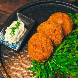 Crab Cakes -  Pan Fry Jackfruit 'Crab Cakes', Rocket, Lemon, Tartar Mayo at Golden State Vegan Sushi in Bangkok