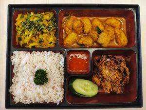 Bento box with some veggies and rice, fake chicken and fish. at Crown Colony Cuisine in Petaling Jaya