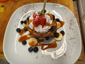 Peanut butter, banana, blueberry and caramel pancake stack at Vegan Earth in Ayr
