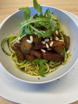 Zucchini spaghetti with pesto and seitan spicy slices  at Vegan Earth in Ayr