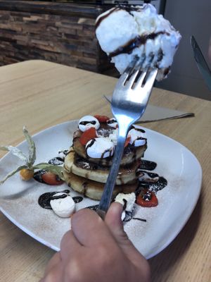 Pancake stack with chocolate sauce, strawberries, marshmallows and icecream  at Vegan Earth in Ayr