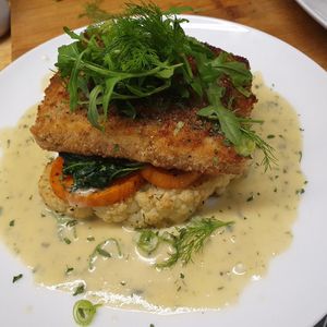 Lemon tofish, roast cauliflower, sweet potato, creamed spinach, set on a fragrant fennel sauce, yummy🥰 at Vegan Earth in Ayr