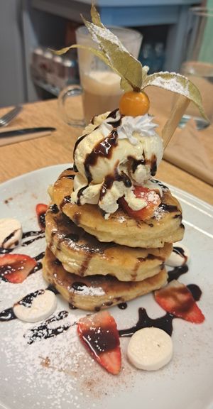 Pancakes with ice cream, strawberries, chocolate sauce, marshmallows at Vegan Earth in Ayr
