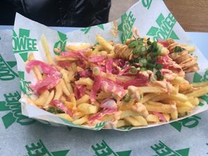 Half eaten Sriracha Loaded Shrimp Fries  at Oowee Vegan in South West London