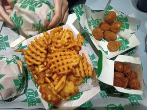 Garlic butter fries, pop corn chicken, chili cheese ball at Oowee Vegan in South West London