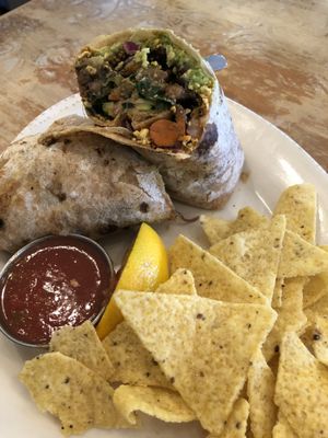 Breakfast burrito with salsa and chips at Pomegranate Cafe in Phoenix
