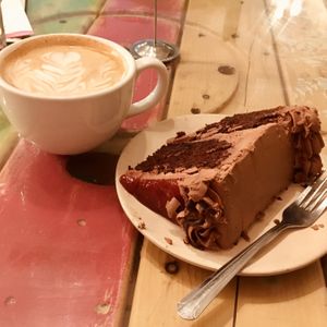 Pumpkin latte and chocolate cake  at Pomegranate Cafe in Phoenix