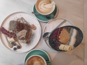 French toast, acai bowl, and soy caffe latte at Birdie & Co - Mittelstraße in Dusseldorf