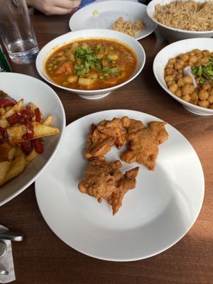 Pakora, multiple curries, loaded fries at Sahil Street Food in Bakewell