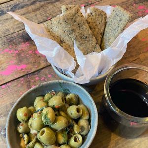Marinated Herb Olives, Woaca flatbread and Natural wine  at Nelsons Wine Bar in Hebden Bridge