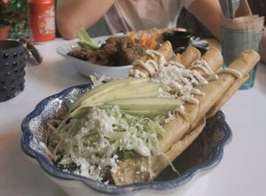 Chopeadotas and the cauliflower wings in the background. at Corazon Contento PDC in Playa Del Carmen
