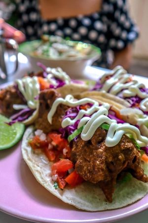 Los fabulosos Tacos Baja, de coliflor tempura con la receta secreta de la casa, acompañados de pico de gallo, col morad, lechuga zanahoria, limón y veganesa. at Corazon Contento PDC in Playa Del Carmen
