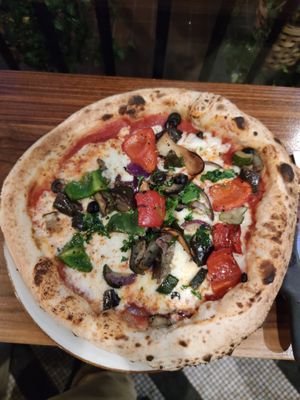 Vegan pizza with vegetables and mushrooms at Vegitalian - Schoutenstraat in Utrecht