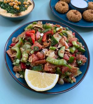 Fatoush Salad
Tomatoes, cucumbers, green and red peppers, 
green onions and fried pieces of pita bread. at Tastes of Damascus in Athens