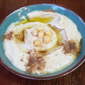 Hummus
The classical levantine appetizer: a delicious mix of chickpeas, tahini (sesame), olive oil and fresh lemon. at Tastes of Damascus in Athens