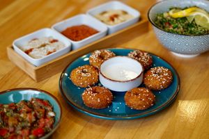 Baba Ganoush
Falafel plate + Mezzés
One plate of falafel served with hummus, moutabal and muhammara. 
Sauce made of yogurt and tahini or vegan sauce with lemon and tahini
Tabo at Tastes of Damascus in Athens