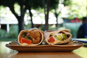 Falafel Sandwich 
Falafel with hummus, tomato, lettuce, pickles inside pita bread. 
- spice level: regular, light, or no sauce
- with yogurt sauce or vegan (tahini and lemon) at Tastes of Damascus in Athens