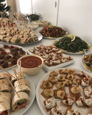 Catering with small falafel wraps, dips with hummus and moutabal, tabouleh salad, mouhamara bowl at Tastes of Damascus in Athens