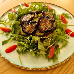 Lasagna: fried Zuchini with spices, marinated tofu, eggplants and baked sweet peppers served with arugula and balsamic sauce 50000som ~ 4usd at Eco Cafe in Tashkent