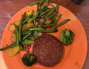 Vegan beyond burger patty with side of grilled veggies.  at Cowboy's Smokehouse Cafe in Panguitch